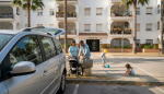 Family loading car outside Javea apartment