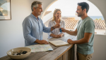 Family hands keys to traveler in Javea rental office
